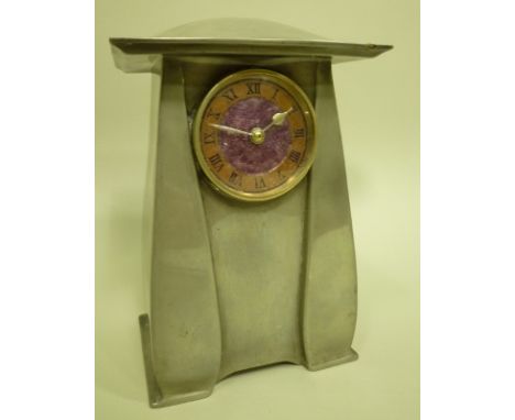 ARCHIBALD KNOX FOR LIBERTY & CO. A TUDRIC PEWTER MANTEL CLOCK, model no. 0761 with rare purple enamelled face and copper nume