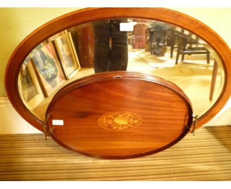 A LATE VICTORIAN/EDWARDIAN MAHOGANY OVAL TEA TRAY, having marquetry centre and twin brass handles, 36cm x 55cm, and an oval s