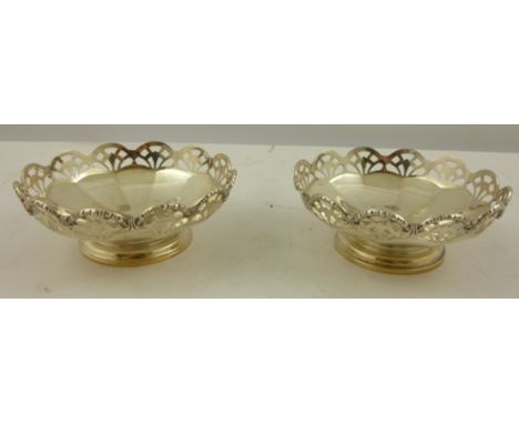 DAVIS DUFT, GLASGOW A PAIR OF SILVER BONBONNIERES each having a fretted and applied wire rim, on a twelve panel lower belly a