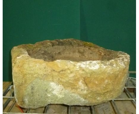 A CARVED STONE GARDEN SINK/PLANTER of horseshoe form, 36cm x 50cm x 17cm high 