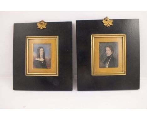 A PAIR OF MID 19TH CENTURY MINIATURE PORTRAIT PAINTINGS, a lady and gentleman of standing, elegantly dressed, both wearing lo