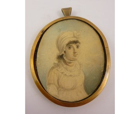 AN EARLY 19TH CENTURY PORTRAIT MINIATURE of a young woman wearing a turban style hat, a Watercolour on card, in oval metal fr