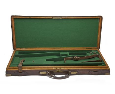 A BRASS-CORNERED OAK AND LEATHER DOUBLE GUNCASE, fitted for 28in. barrels (could adapt to 30in.), the interior re-lined with 