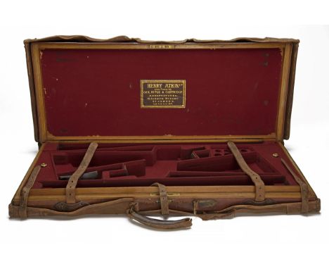 HENRY ATKIN LTD. A BRASS-CORNERED OAK AND LEATHER DOUBLE GUNCASE, fitted for 28in. barrels (could adapt to 31in.), the interi