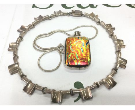 A silver choker necklace and a coloured glass pendant on chain (2). Shipping category A.
