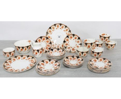 'Daisy' pattern porcelain part tea service; comprising two plates 8.5" diameter, eleven plates 6" diameter, seven cups with n