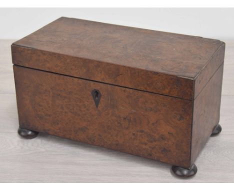19th century burr walnut tea caddy, the hinged cover enclosing a divided interior with removable tiers over three compartment