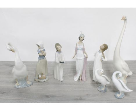 Lladro porcelain&nbsp;figurine 'Talk of the Town',&nbsp;no.5788, 10.25" high; together with two further Lladro figures of you