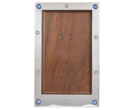 A GEORGE V SILVER AND ENAMEL PHOTOGRAPH FRAME, LIBERTY & CO. (CYMRIC) LTD., BIRMINGHAM, 1919 plain rectangular excepting smal