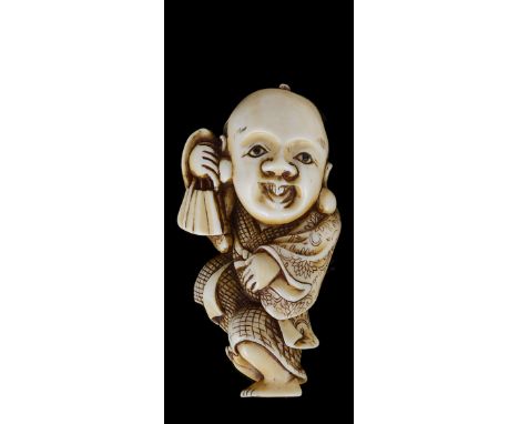 ˜A JAPANESE IVORY NETSUKE OF FUKUSUKE, EDO PERIOD, 19TH CENTURY carved as the boy dancer standing with a fan, stained detail,