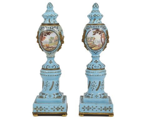 A PAIR OF GEORGE III ENAMEL CASSOLETTES, SOUTH STAFFORDSHIRE, CIRCA 1780 turquoise ground, gilt-metal mounted, the tops to th