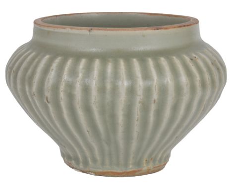 A CHINESE CELADON SMALL JAR, YUAN DYNASTY (1279-1368) lobed ogee body, on a recessed base, olive green glaze 13.5cm diameter