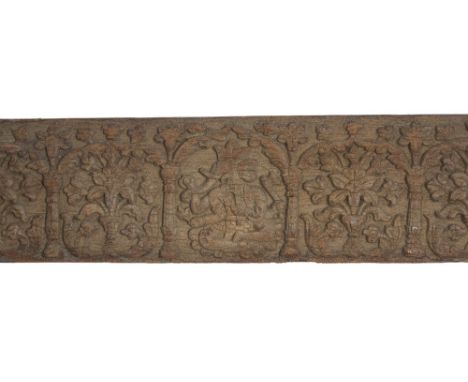 A CARVED WOOD ARCHITECTURAL FRIEZE, PUNJAB, PROBABLY CHAMBA, 18TH CENTURY carved in low relief, depicting a crowned figure of