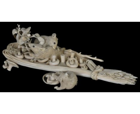 ˜A JAPANESE IVORY OKIMONO GROUP OF RATS, MEIJI PERIOD (1868-1912) the three rodents playing on a reed paddle filled with mush