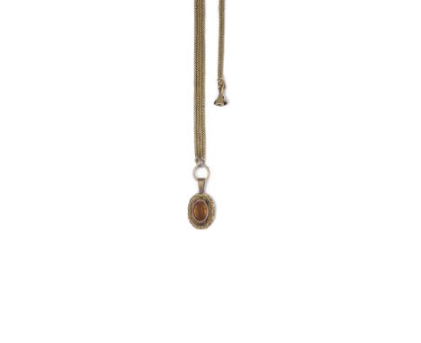 CITRINE AND ENAMEL PENDANT AND MUFF CHAIN, 1850s the oval citrine within a black enamel and repossé scroll border on a double
