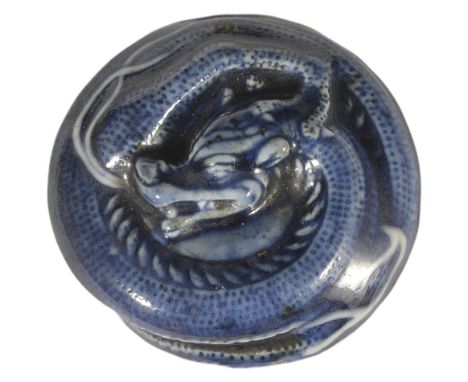 A JAPANESE BLUE AND WHITE PORCELAIN MANJU NETSUKE OF A DRAGON, LATE EDO PERIOD, CIRCA 1850 unsigned,  4.9cm diameter Provenan