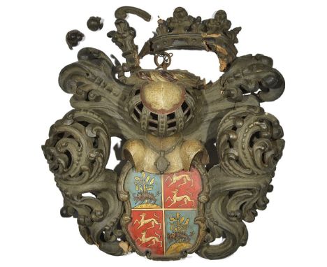 A CARVED POLYCHROME WOOD ARMORIAL BEARING, CONTINENTAL, LATE 17TH / EARLY 18TH CENTURY the shaped shield later painted with t