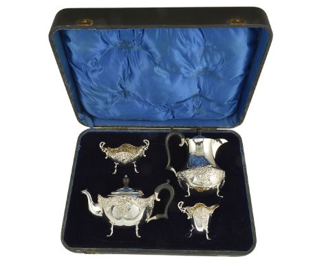 A VICTORIAN SILVER FOUR-PIECE TEA SET, JAMES DEAKIN & SONS LTD. AND H. MATTHEWS, CHESTER AND BIRMINGHAM, 1898/99 oval, die-st