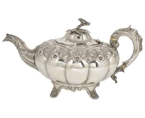 ˜A VICTORIAN SILVER TEAPOT, EDWARD JOSEPH OVERSTRIKING ROBERT HARPER, LONDON, 1863 compressed melon shaped, chased to the sho