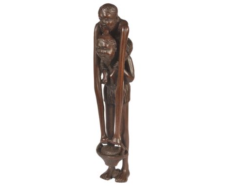 A JAPANESE WOOD NETSUKE OF ASHINAGA AND TENAGA, MEIJI PERIOD (1868-1912) long arms riding on the back of long legs, signed To