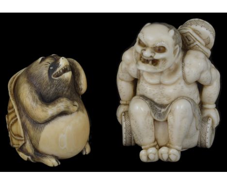 ˜A JAPANESE IVORY NETSUKE OF RAIDEN (THE THUNDER GOD), EDO PERIOD, MID 19TH CENTURY seated with drums, stained detail, unsign