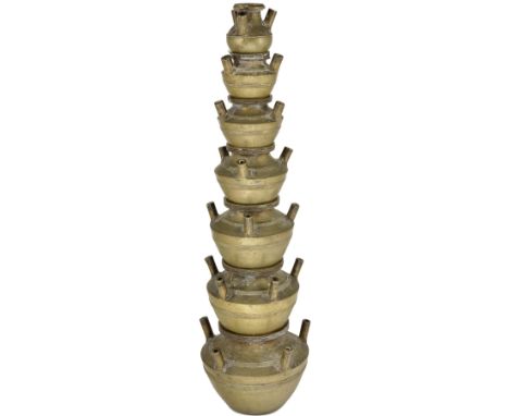 A BRASS TEMPLE LAMP OR CENSER, SOUTHERN INDIA, CIRCA 19TH CENTURY in the form of a tapering stack of seven lota vessels, each