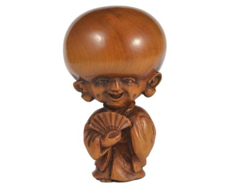 A JAPANESE BOXWOOD NETSUKE OF FUKUSUKE, EARLY MEIJI PERIOD, CIRCA 1870 typically carved with exaggerated and somewhat phallic