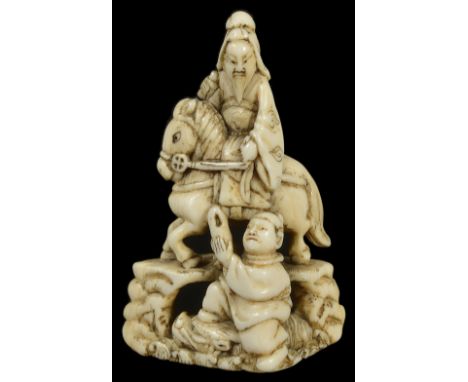 ˜A JAPANESE IVORY NETSUKE OF CHORYO AND KOSEKIKO, LATE EDO PERIOD, CIRCA 1800 Choryo seated on a dragon and handing the shoe 