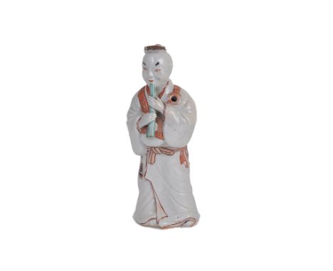A JAPANESE ARITA FIGURE OF A MUSICIAN, EDO PERIOD, LATE 17TH CENTURY modelled as a man in long robes playing a pipe 18cm high