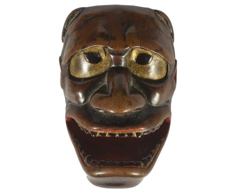 A JAPANESE PARTLY LACQUERED WOOD MASK NETSUKE OF NAMANARI, LATE EDO PERIOD, CIRCA 1820 unsigned 5.5cm high Provenance: Julius
