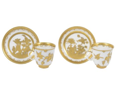 TWO MEISSEN CUPS AND SAUCERS WITH AUGSBURG GILT DECORATION, CIRCA 1730 the gilding, probably Abraham Seuter workshop, of Chin