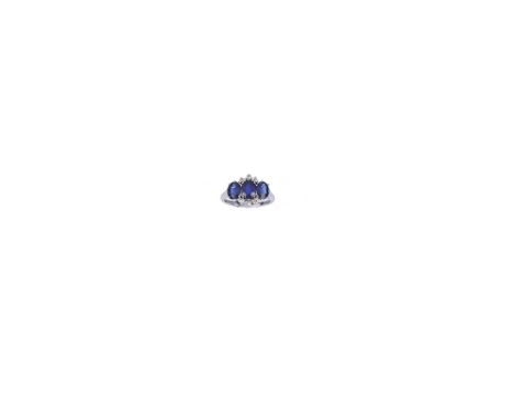 SAPPHIRE AND DIAMOND RING designed as a row of three slightly graduated oval sapphires accented with six cushion shaped diamo