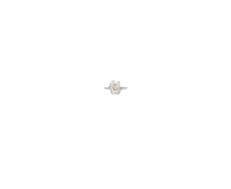 DIAMOND RING the cushion shaped diamond weighing 4.94 carats in a six claw setting size R ½ 