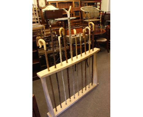 Elm stick stand and ten various walking sticks and crooks