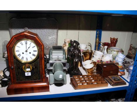 Shelf clock, editions of The War Papers, projector, two lamps, watch stand and watches, wall rack, tea caddy, pair figures, c