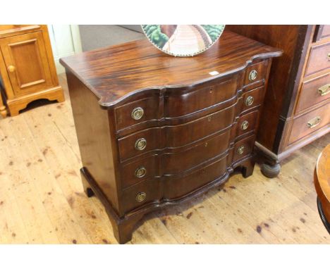 Mahogany shaped front chest of four long drawers on bracket feet, 87.5cm by 75cm