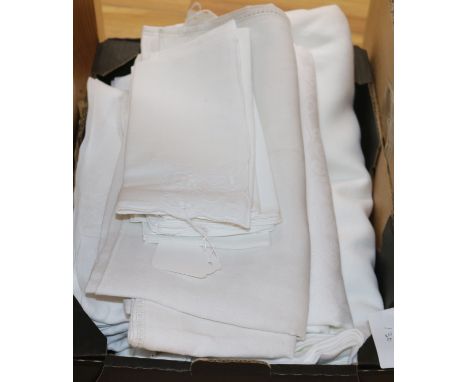 A quantity of linen table cloths and d'oyleys