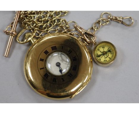 A George V 18ct gold Tavannes Watch Co. half hunter dress pocket watch and a 9ct gold albert with 9ct gold compass charm, the