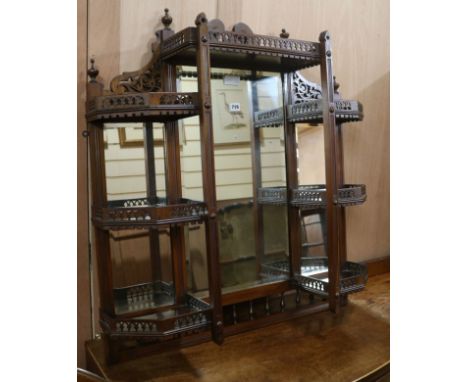 A hanging mirrored wall shelf W.84cm