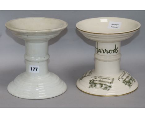 Two white glazed ceramic ham bone stands, one printed "Harrods"