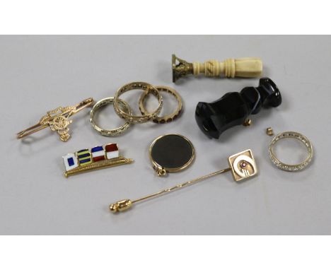 Four assorted 9ct gold and gem set eternity rings, a stick pin, two yellow metal brooches, a hematite pendant, two earring bu