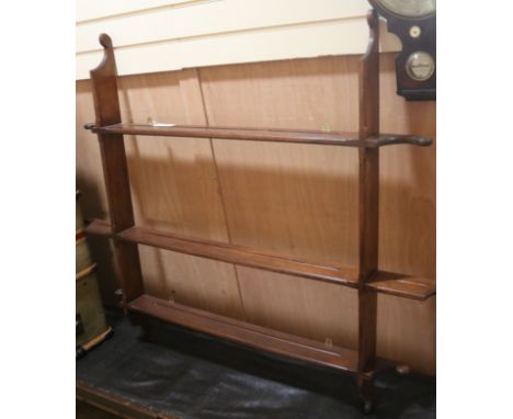 An Edwardian mahogany wall shelf W.148cm