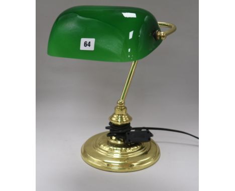 A brass and green glass lamp height 34cm