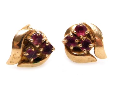 A pair of ruby three stone earrings, set in yellow metal, stamped 14k, 1.6g.