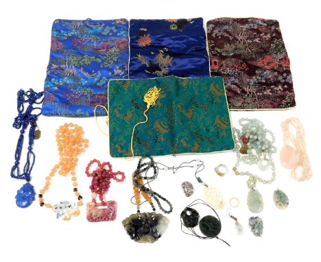 A group of Chinese jade agate and crystal pendants, beads and rings. (a quantity) 