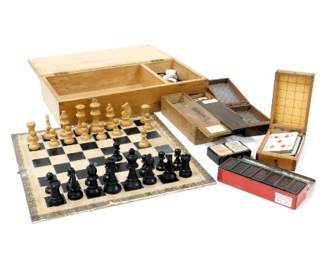 A Staunton type chess set, and draughts, boxed with a board, together with two cribbage boards, a box of patience cards, and 