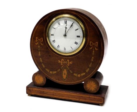 An Edwardian mahogany and inlaid mantel clock, circular enamel dial bearing Roman numerals, eight day clockwork movement, the