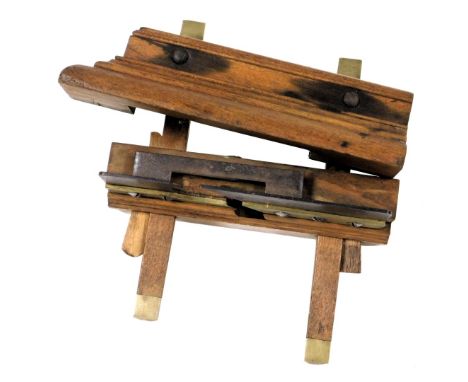 A 19thC oak and brass sash fillester plane, 23cm wide.