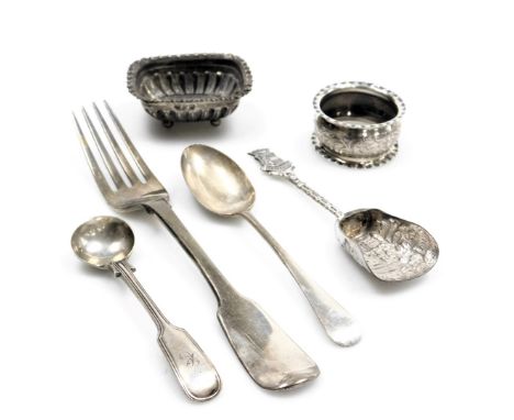 A George IV silver Old English pattern table fork, London 1822, Victorian silver teaspoon and mustard spoon, napkin ring and 