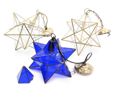 Two metal framed tetrahedron star shaped ceiling lights, 35cm and 31cm high, together with a blue glass tetrahedron star shap